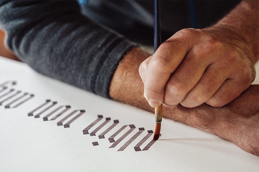 Kalligraphie-Schriftzug von Hand gemalt